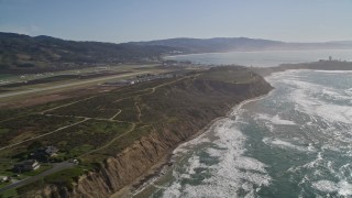 AXSF15_049 - 5K aerial stock footage pan from Half Moon Bay Airport to Pillar Point Air Force Station, Half Moon Bay, California