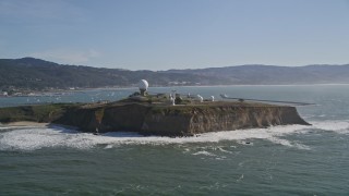 AXSF15_050 - 5K aerial stock footage of flying by Pillar Point Air Force Station, Half Moon Bay, California