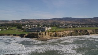 AXSF15_057 - 5K aerial stock footage of flying away from The Ritz Carlton hotel on coastal cliffs, Half Moon Bay, California