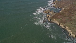 AXSF15_073 - 5K aerial stock footage of a reverse view of the rugged coast and ocean waves, Pescadero, California