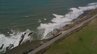 AXSF15_079 - 5K aerial stock footage of the Highway 1 coastal road in Davenport, California