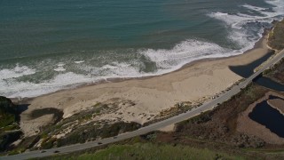 AXSF15_080 - 5K aerial stock footage flyby the Highway 1 coastal road, revealing a beach, Davenport, California