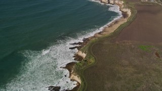 AXSF15_087 - 5K aerial stock footage of a reverse view of coastal beaches, Davenport, California