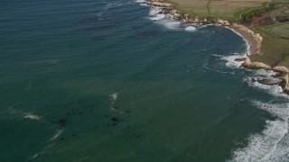 AXSF15_089 - 5K aerial stock footage of flying away from coastal cliffs, Santa Cruz, California