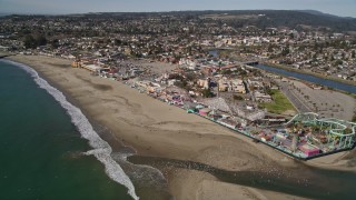 AXSF15_105 - 5K aerial stock footage orbit and fly away from the beach and rides at the Santa Cruz Beach Boardwalk, Santa Cruz, California