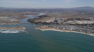 AXSF15_113 - 5K aerial stock footage of a power plant with smoke stacks near a beach, Moss Landing, California