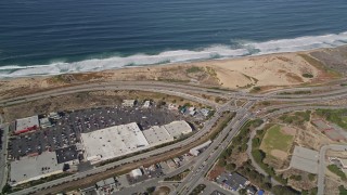 AXSF15_117 - 5K aerial stock footage fly away from Fort Ord Dunes State Park, reveal Highway 1 coastal road, Moss Landing, California