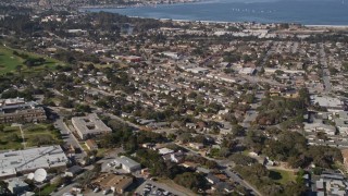 AXSF15_121 - Aerial stock footage of 5K aerial  video tilt from neighborhood to reveal Monterey Peninsula and Monterey Bay, Monterey, California