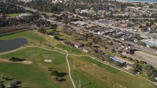 AXSF16_002 - 5K aerial stock footage tilt from golf course to reveal coastal neighborhoods on the Monterey Peninsula, Monterey, California