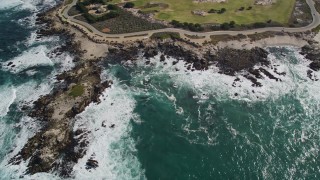AXSF16_015 - 5K aerial stock footage tilt from coast to reveal Point Pinos Lighthouse Reservation, Monterey, California
