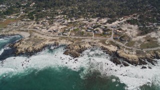 AXSF16_017 - 5K aerial stock footage of flying by coastal homes on Sunset Drive, Pacific Grove, California