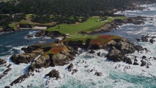 AXSF16_023 - 5K aerial stock footage of rugged coastline around Cypress Point Golf Course, Pebble Beach, California