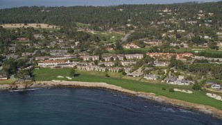 AXSF16_033 - 5K aerial stock footage reverse view of Pebble Beach Golf Links and Pebble Beach Resorts, California
