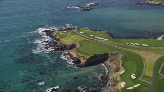 AXSF16_036 - 5K aerial stock footage of a waterfront golf course by Carmel Bay, Pebble Beach, California