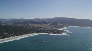 AXSF16_037 - 5K aerial stock footage of flying over Carmel Bay, pan over beaches, beachfront homes, Carmel, California