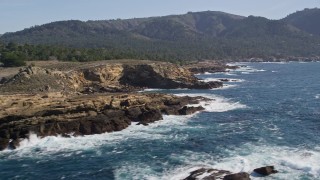 AXSF16_048 - 5K aerial stock footage of passing coastal cliffs in Carmel, California