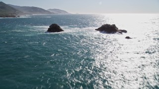 AXSF16_053 - 5K aerial stock footage of tilting from the ocean to reveal coastal rock formations, Carmel, California