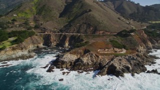 AXSF16_064 - 5K aerial stock footage of flying by the Highway 1 coastal road winding around the coastline, Carmel, California