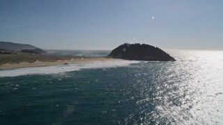 AXSF16_084 - 5K aerial stock footage of tilting up from ocean revealing Point Sur Light Station, Big Sur, California