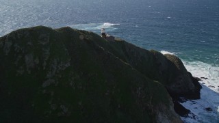 AXSF16_088 - 5K aerial stock footage of approaching the Point Sur Light Station, above the coastline, Big Sur, California