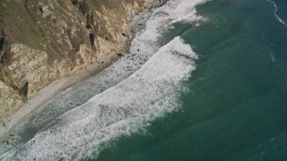 AXSF16_110 - 5K aerial stock footage of a bird's eye view of coastal cliffs, revealing rocky beach, Big Sur, California