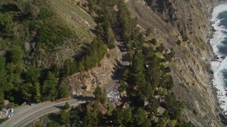 AXSF16_111 - 5K aerial stock footage approach and fly over Highway 1 winding top coastal cliffs, Big Sur, California