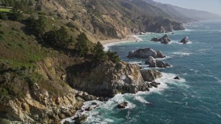 AXSF16_118 - 5K aerial stock footage of flying over rock formations and coastal cliffs, Big Sur, California