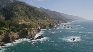 AXSF16_122 - 5K aerial stock footage following the coastline, waves crashing into rocks, Big Sur, California