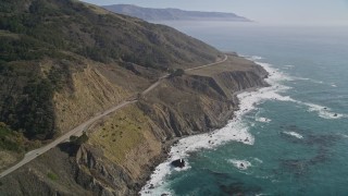 AXSF16_132 - 5K aerial stock footage Highway 1 with light traffic and coastal cliffs, Big Sur, California