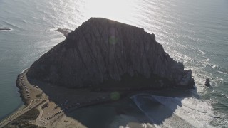 AXSF16_153 - 5K aerial stock footage of flying by Morro Rock overlooking the ocean in Morro Bay, California