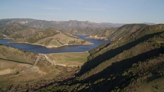 AXSF17_001 - 5K aerial stock footage of flying by Lopez Lake and Lopez Dam, San Luis Obispo County, California