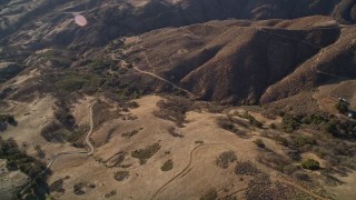 AXSF17_016 - 5K aerial stock footage of flying away from country roads in the hills, San Luis Obispo County, California