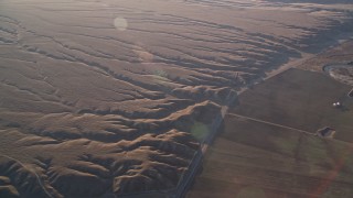 AXSF17_030 - 5K aerial stock footage of deep cracks in the desert, Cuyama Valley, California