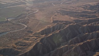 AXSF17_031 - 5K aerial stock footage of flying by a dry riverbed and Caliente Range mountains, Cuyama Valley, California