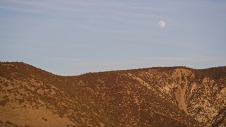 AXSF17_056 - 5K aerial stock footage flying by the a ridge in the Temblor Range with the moon overhead, San Luis Obispo County, California