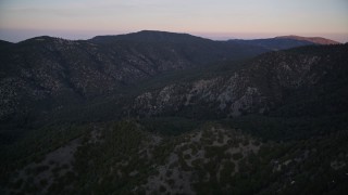 AXSF17_061 - 5K aerial stock footage of flying by mountain ridges, Los Padres National Forest, California, twilight