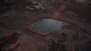 AXSF17_066 - 5K aerial stock footage of flying by small lake in Los Padres National Forest, California, sunset