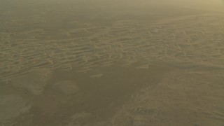 CAP_001_008 - HD stock footage aerial video of sand dunes during a hazy sunrise in Al Gharbia, Abu Dhabi, UAE