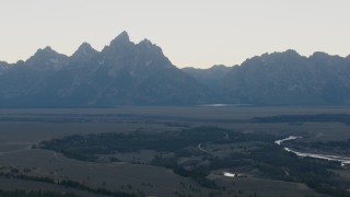 CAP_002_007 - HD stock footage aerial video of rugged mountains in Jackson Hole, Wyoming, twilight