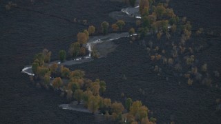 CAP_002_016 - HD stock footage aerial video of a river and autumn trees in Jackson Hole, Wyoming, twilight