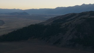 CAP_002_018 - HD stock footage aerial video of flying over Blacktail Butte, Jackson Hole, Wyoming, twilight