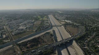 CAP_003_002 - HD stock footage aerial video fly over freeway and follow the LA River in South Gate, California