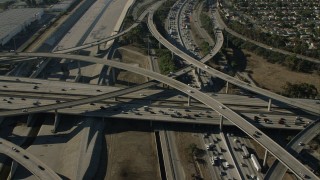 CAP_003_005 - HD stock footage aerial video of heavy traffic on a freeway interchange by the LA River in Lynwood, California