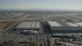 CAP_003_006 - HD stock footage aerial video approach hangars at Long Beach Airport, California
