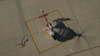 CAP_004_001 - HD stock footage aerial video of a firefighting helicopter on the ground at Van Nuys Airport, California