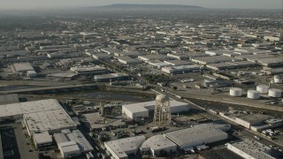 CAP_004_023 - HD stock footage aerial video of warehouses and a water tower by LA River in Vernon, California