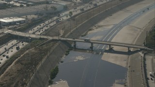 CAP_004_028 - HD stock footage aerial video of a bridge spanning the LA River in Bell, California
