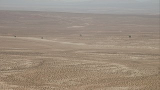 CAP_005_001 - HD stock footage aerial video track four military helicopters flying over the Mojave Desert, California