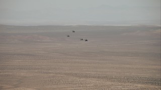 CAP_005_003 - HD stock footage aerial video of military helicopters over the Mojave Desert, California