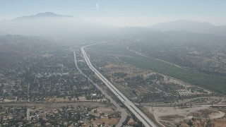 CAP_006_005 - HD stock footage aerial video of flyby suburban neighborhoods and the 210 freeway in Lake View Terrace, California